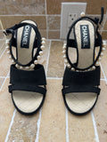 Chanel black suede sandals featuring distinctive faux-pearl embellishments