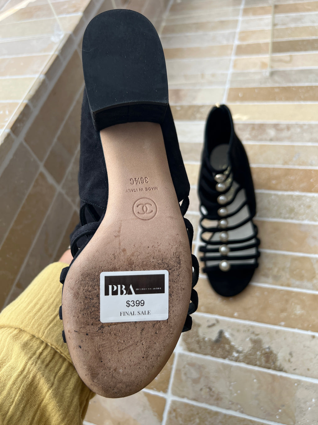 Chanel black strappy heels featuring decorative pearl embellishments